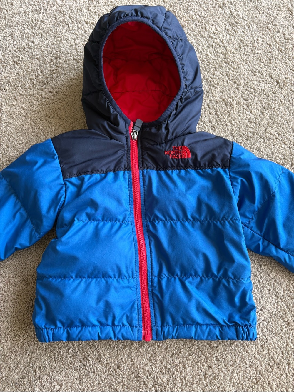 The North Face Bright Blue and Navy Puffer Jacket with Red Accents